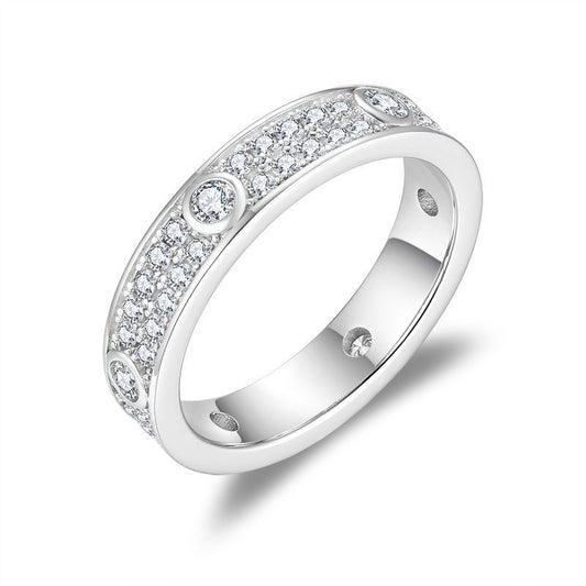 Angled product view of double row pavé moissanite full eternity band showcasing side bezel details.