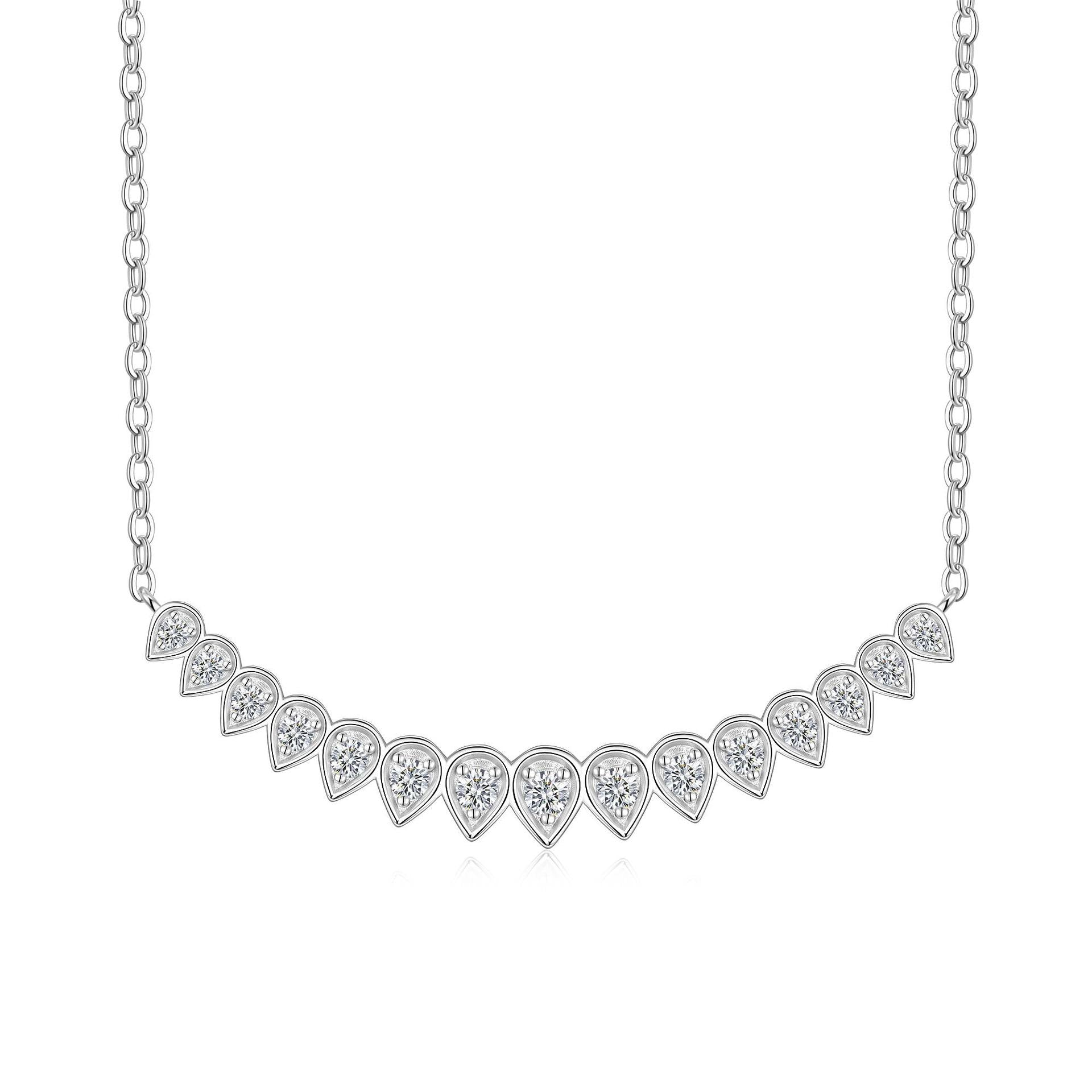 Pear cut bezel set moissanite curved smile necklace in sterling silver.