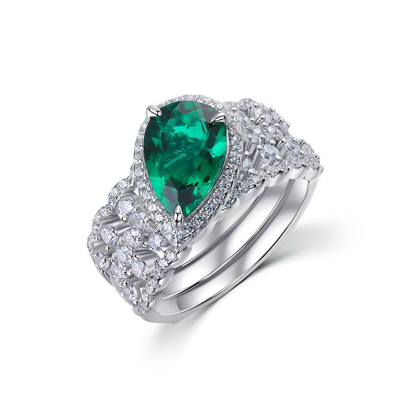 Luxury 2-piece pear-cut emerald stackable ring set for women in silver with a brilliant pave band.