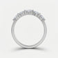 Side arch profile shot of pear cut lab diamond half eternity band ring.