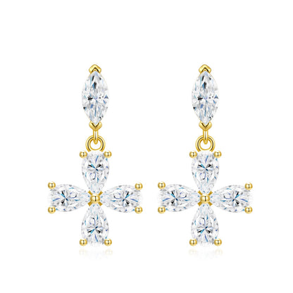 Gold dangle drop earrings featuring marquise stud top and pear-cut moissanite floral cross pendant on white background.