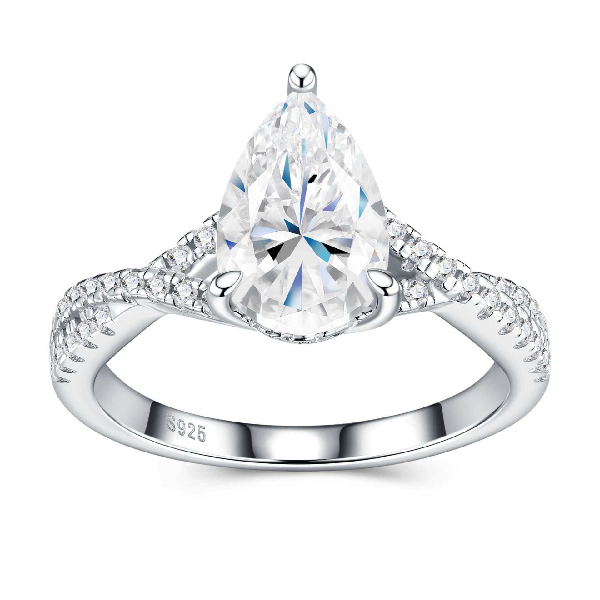 Front view of pear-cut moissanite ring showing brilliant sparkle and intricate stone setting