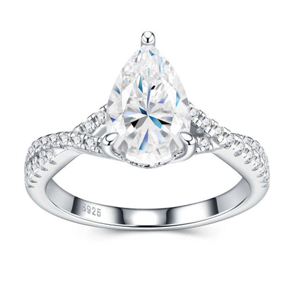 Front view of pear-cut moissanite ring showing brilliant sparkle and intricate stone setting