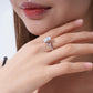 Elegant pear-cut moissanite twisted pavé ring worn on finger, minimalist luxury aesthetic