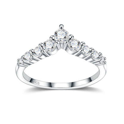 Symmetrical studio display of a platinum plated chevron moissanite v shaped crown ring with graduated side stones.