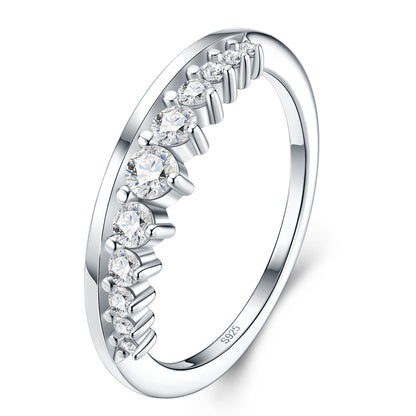 Three-quarter studio catalog view of a platinum plated curved moissanite matching tiara ring with graduated shared prongs.