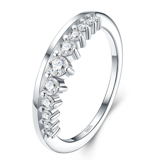 Three-quarter studio catalog view of a platinum plated curved moissanite matching tiara ring with graduated shared prongs.