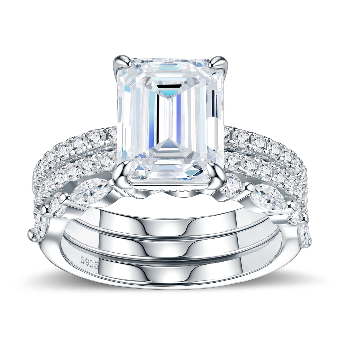 Symmetrical studio display of platinum plated emerald cut moissanite 3 piece stacking ring set with marquise and pave bands.