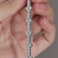 Elegant flat lay featuring 4–5 multi-shape bracelets on neutral backdrop with varied cut illustrations. Alt: “925 Sterling Silver Multi-Shape Moissanite Tennis Bracelets Collection.”