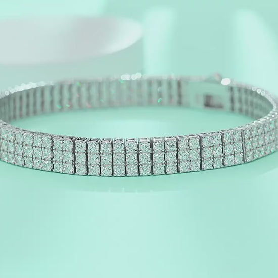 Yellow gold three-row moissanite bracelet on neutral background. Alt: “Three-Row Moissanite Tennis Bracelet – 18K Yellow Gold.”