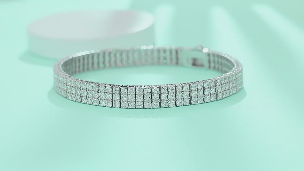 Yellow gold three-row moissanite bracelet on neutral background. Alt: “Three-Row Moissanite Tennis Bracelet – 18K Yellow Gold.”