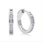 Princess cut moissanite channel set huggie hoop earrings in sterling silver isolated on white background