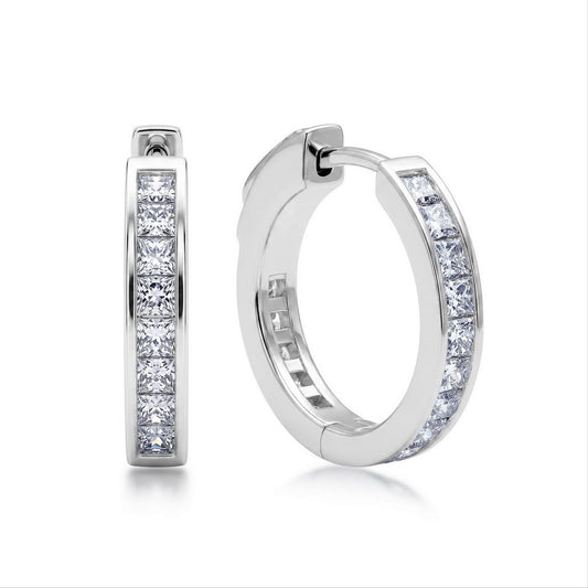 Princess cut moissanite channel set huggie hoop earrings in sterling silver isolated on white background