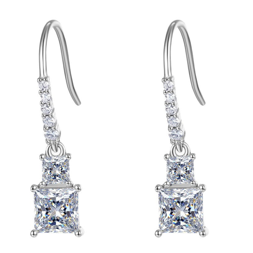 Pair of princess cut two-stone dangle drop earrings with pavé line French wire in 925 silver.