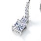 Close-up view of graduated princess cut two-stone dangle pendant showing pavé-set line hook.