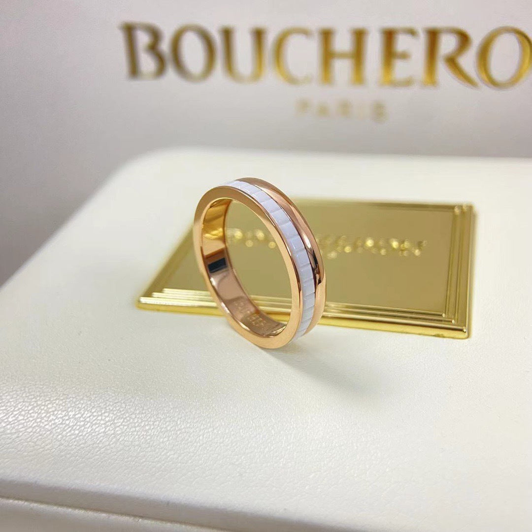 Luxury Quatre inspired white ceramic Clou de Paris stackable wedding band with an elegant yellow gold plated finish.