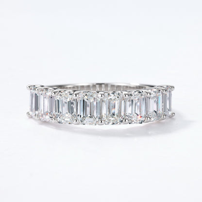 Front view of emerald cut diamond simulant half-eternity anniversary band.