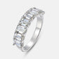 Radiant emerald cut diamond simulant half-eternity anniversary band ring in 925 silver.