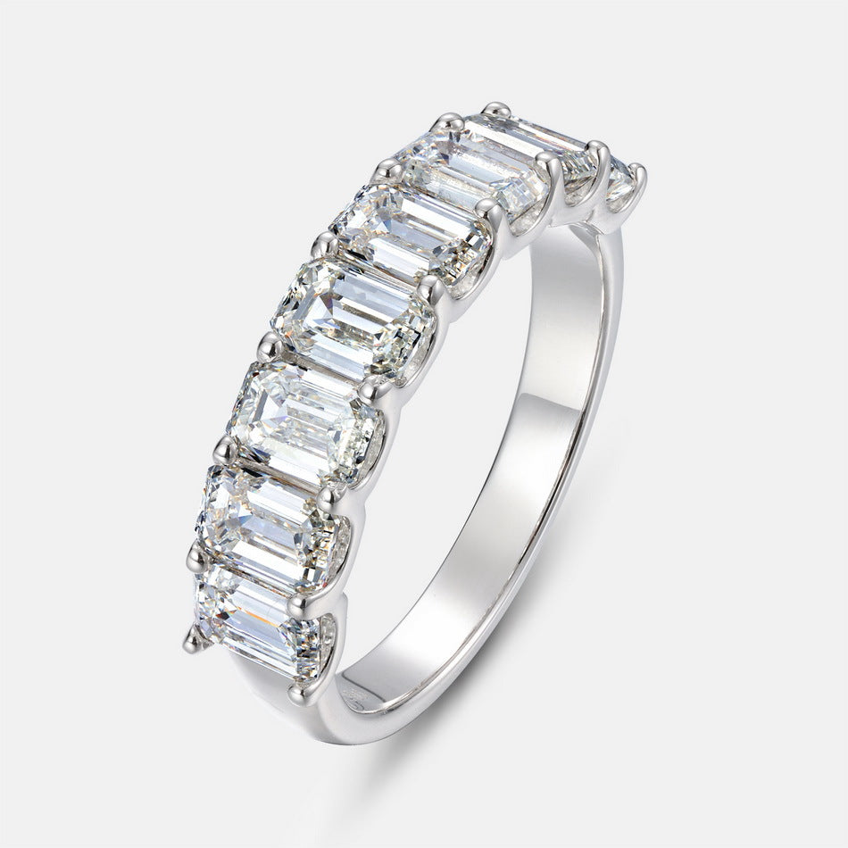Radiant emerald cut diamond simulant half-eternity anniversary band ring in 925 silver.