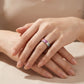 Model wearing rainbow baguette cut multi-color gemstone channel set ring.