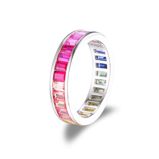 Rainbow baguette cut multi-color gemstone channel set eternity ring in 925 sterling silver.