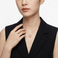 Model wearing the rose gold clover moissanite pendant necklace in an elegant outfit.