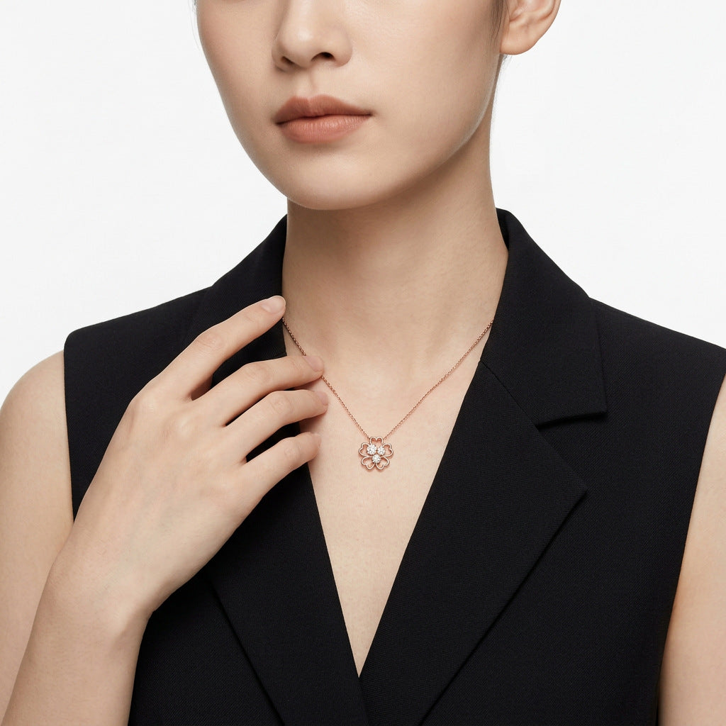 Model wearing the rose gold clover moissanite pendant necklace in an elegant outfit.