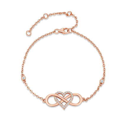Rose gold infinity heart pavé moissanite station chain bracelet in 925 sterling silver.