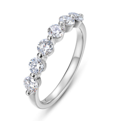 Angled perspective of 7-stone round brilliant diamond simulant wedding band ring.