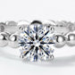 Extreme close-up shot showing center round brilliant stone and beaded bubble band.