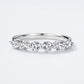 Round brilliant diamond simulant 7-stone half-eternity anniversary wedding band ring in 925 silver.