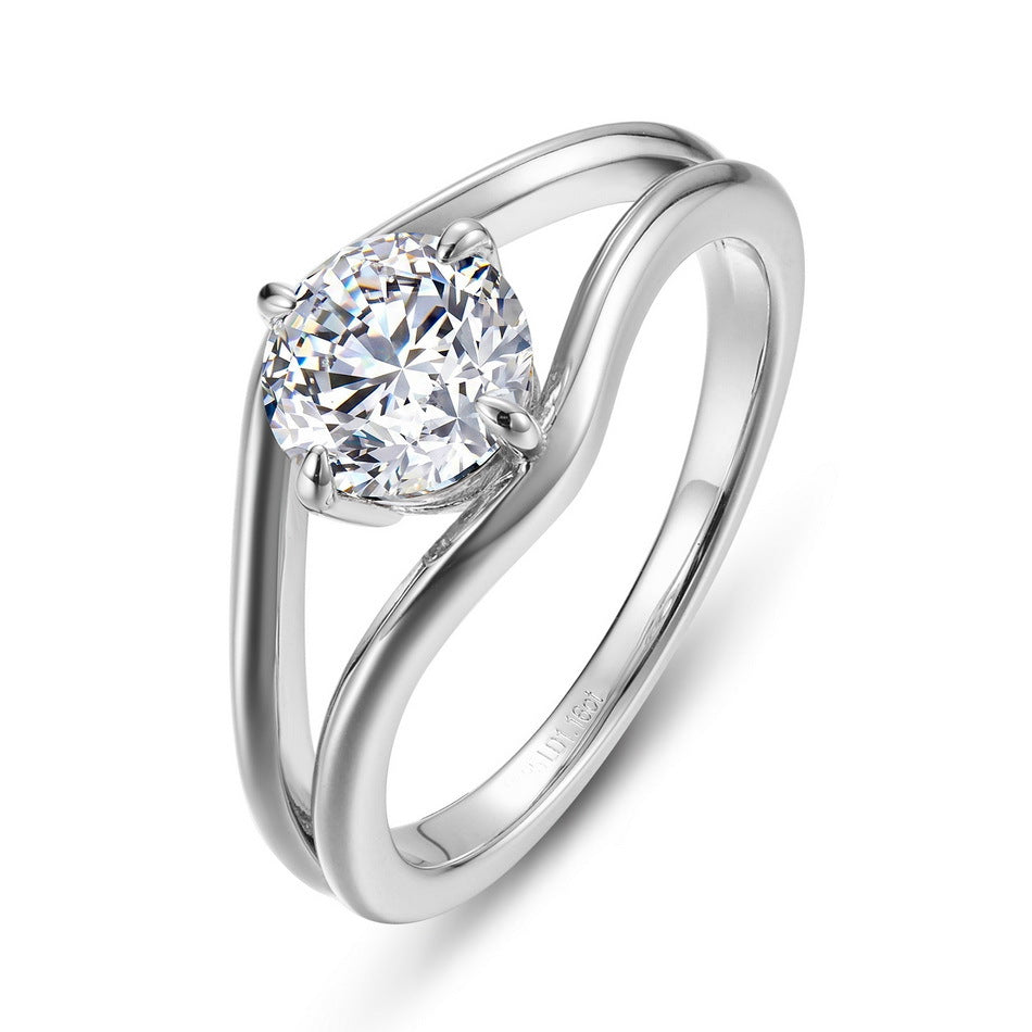 Round brilliant diamond simulant swirl bypass engagement ring in 925 silver.