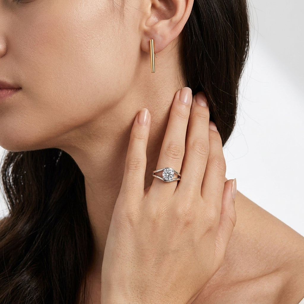 Model wearing round brilliant diamond simulant swirl bypass engagement ring.