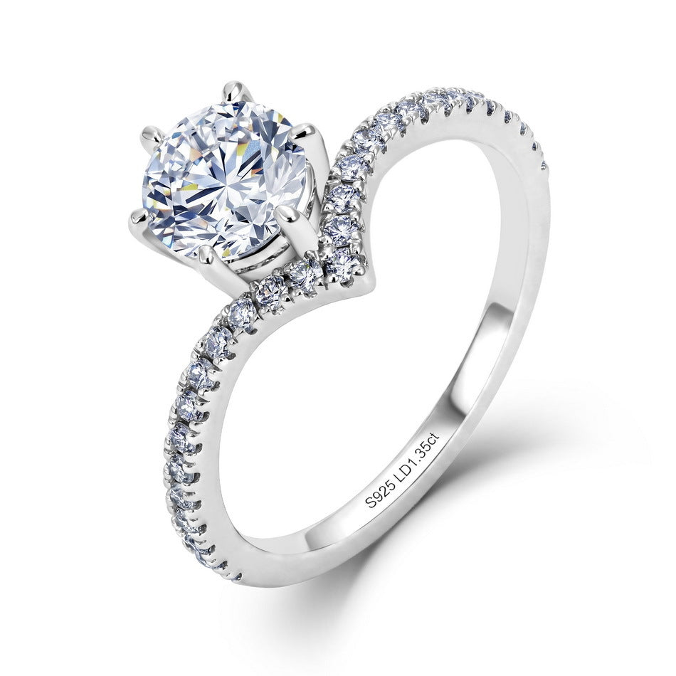 Round cut diamond six-prong v-shape chevron engagement ring with pavé band in 925 silver 1.35ctw.