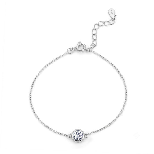 Round cut lab grown diamond bezel set solitaire chain bracelet in 925 sterling silver.