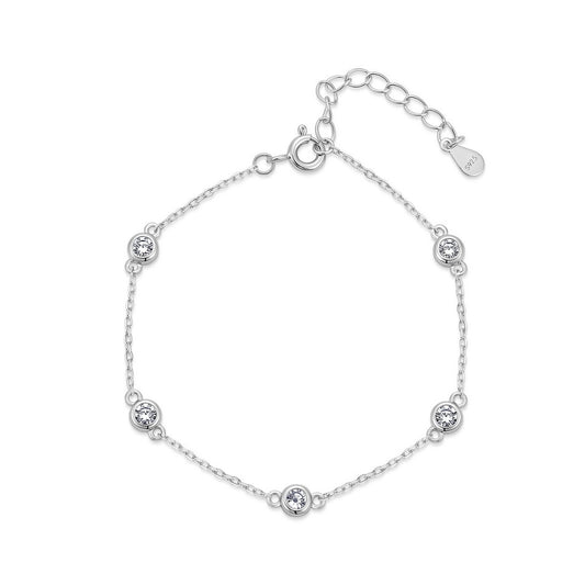 Round cut lab grown diamond bezel set station chain bracelet in 925 sterling silver.