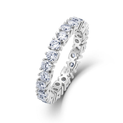 Round cut lab grown diamond eternity ring in sterling silver isolated on white background