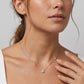 Model wearing round cut lab grown diamond halo pendant necklace