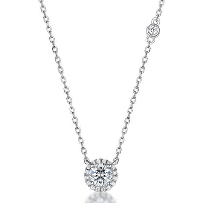 Round cut lab grown diamond halo pendant necklace in sterling silver isolated on white background