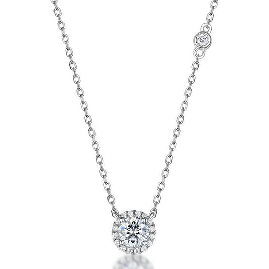 Round cut lab grown diamond halo pendant necklace in sterling silver isolated on white background
