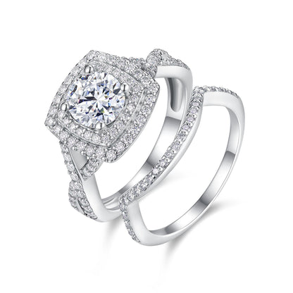 Round cut moissanite double cushion halo engagement ring paired with curved nesting band on white background.