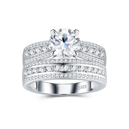 Round cut moissanite bridal ring set with multi-row pave band on white background.