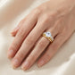 Model wearing round cut moissanite solitaire double pavé stackable ring set.