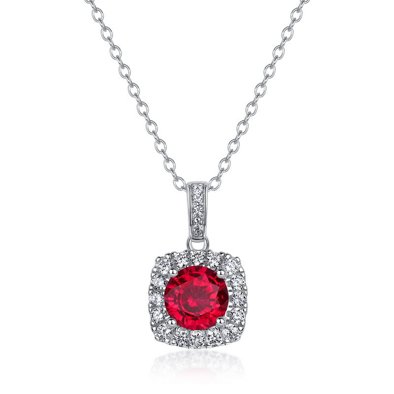 Elegant round-cut ruby square frame pendant necklace with a brilliant diamond halo on a sterling silver chain.