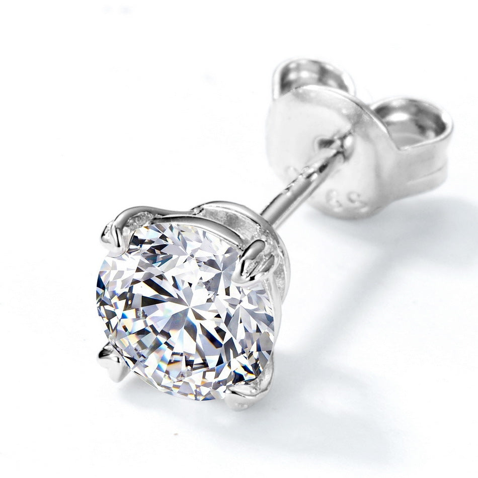Side profile view of round diamond solitaire stud earring showing heart prong basket and friction back.