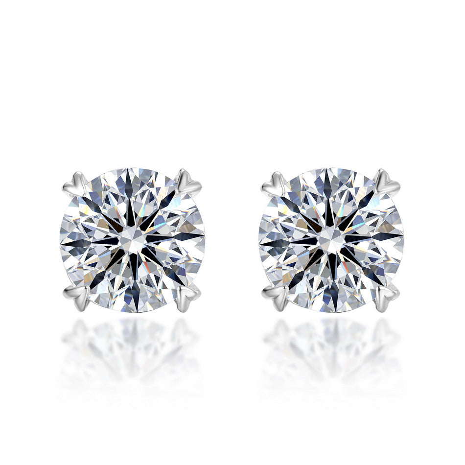Pair of round cut diamond solitaire stud earrings with heart prongs in 925 silver.