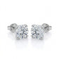 Frontal view of round diamond solitaire stud earrings with romantic heart shaped prongs.