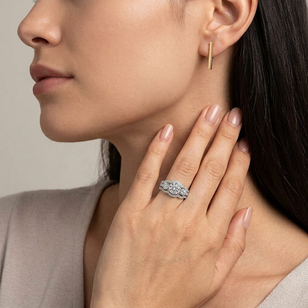 Model wearing round lab-grown diamond 3-stone bridal ring set.