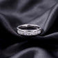 Frontal view of round lab-grown diamond channel set wedding band ring.