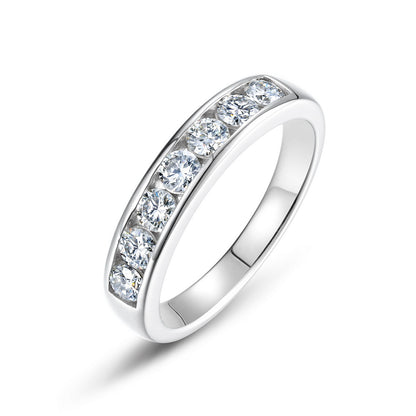 Round lab-grown diamond channel set wedding band ring in 925 sterling silver.